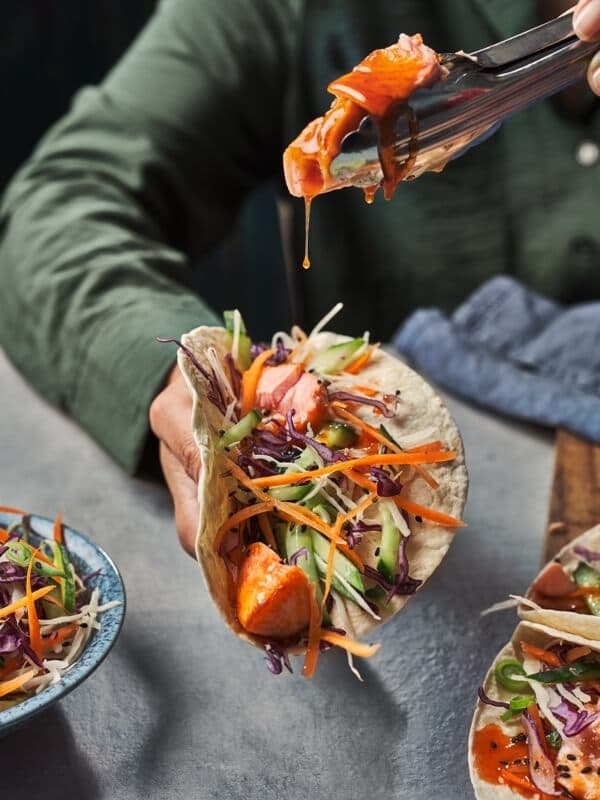 Honey sriracha salmon tacos with sesame lime slaw