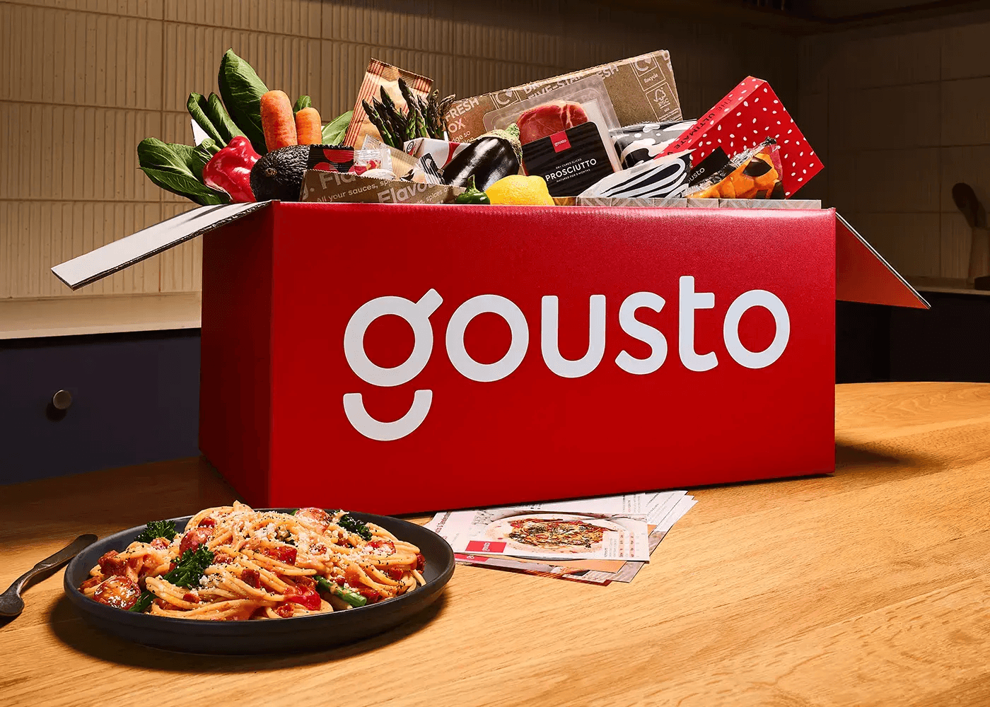 Gousto recipe box filled with fresh ingredients